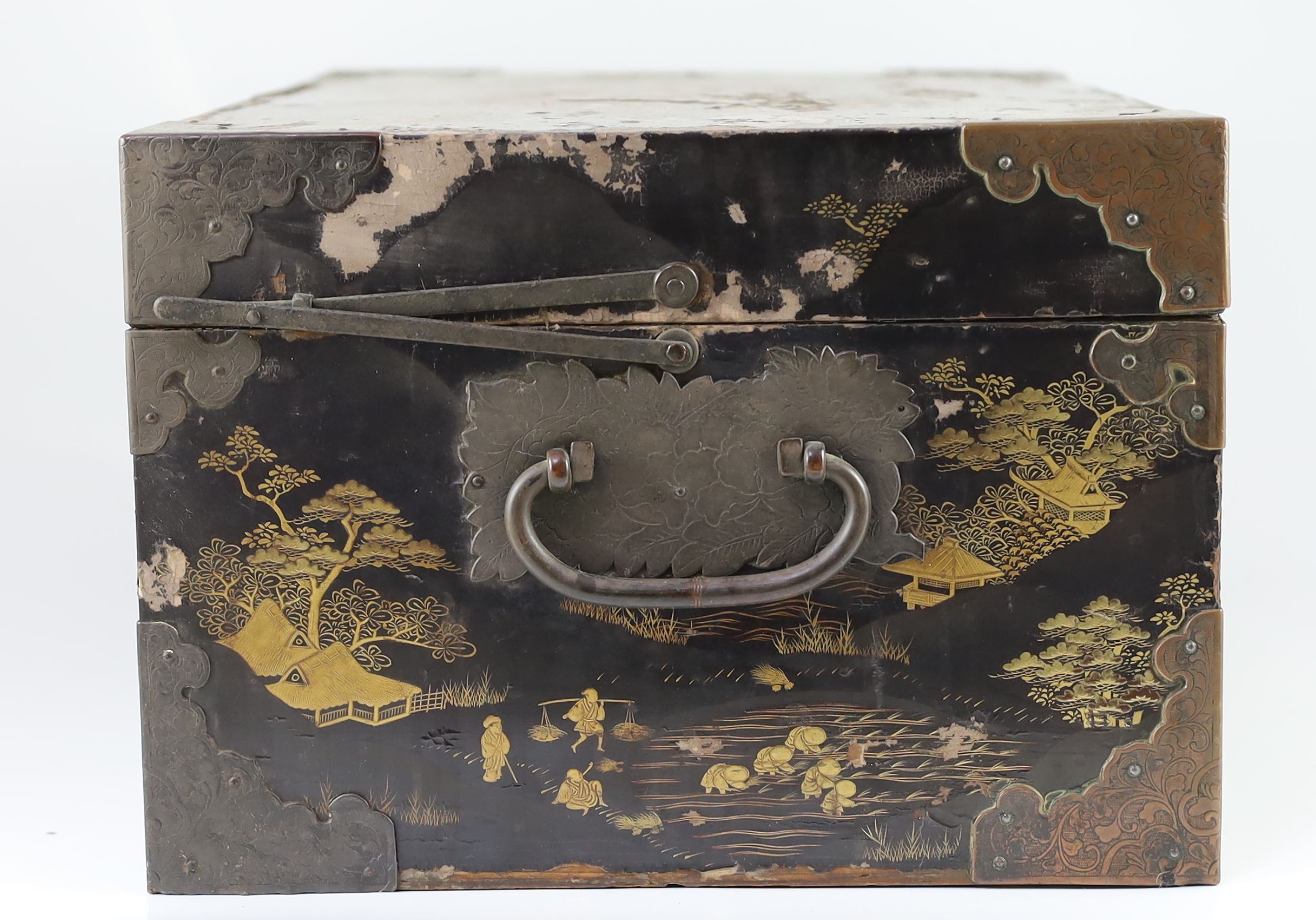 A Japanese lacquer fitted travelling trunk, 19th century, 55cm wide, H 23cm. D 32cm. Some losses to lacquer and wear to mounts